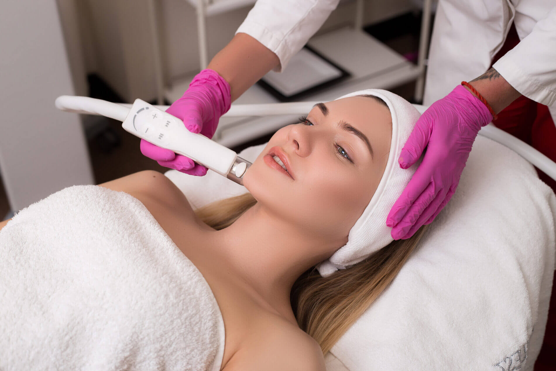 Be always young! Side-view portrait of a young woman with a towel on her head lying on a table getting a skin treatment in healthy beauty spa salon. | M8 Microneedling RF by Casa Glow Inc in East 22nd Street New York